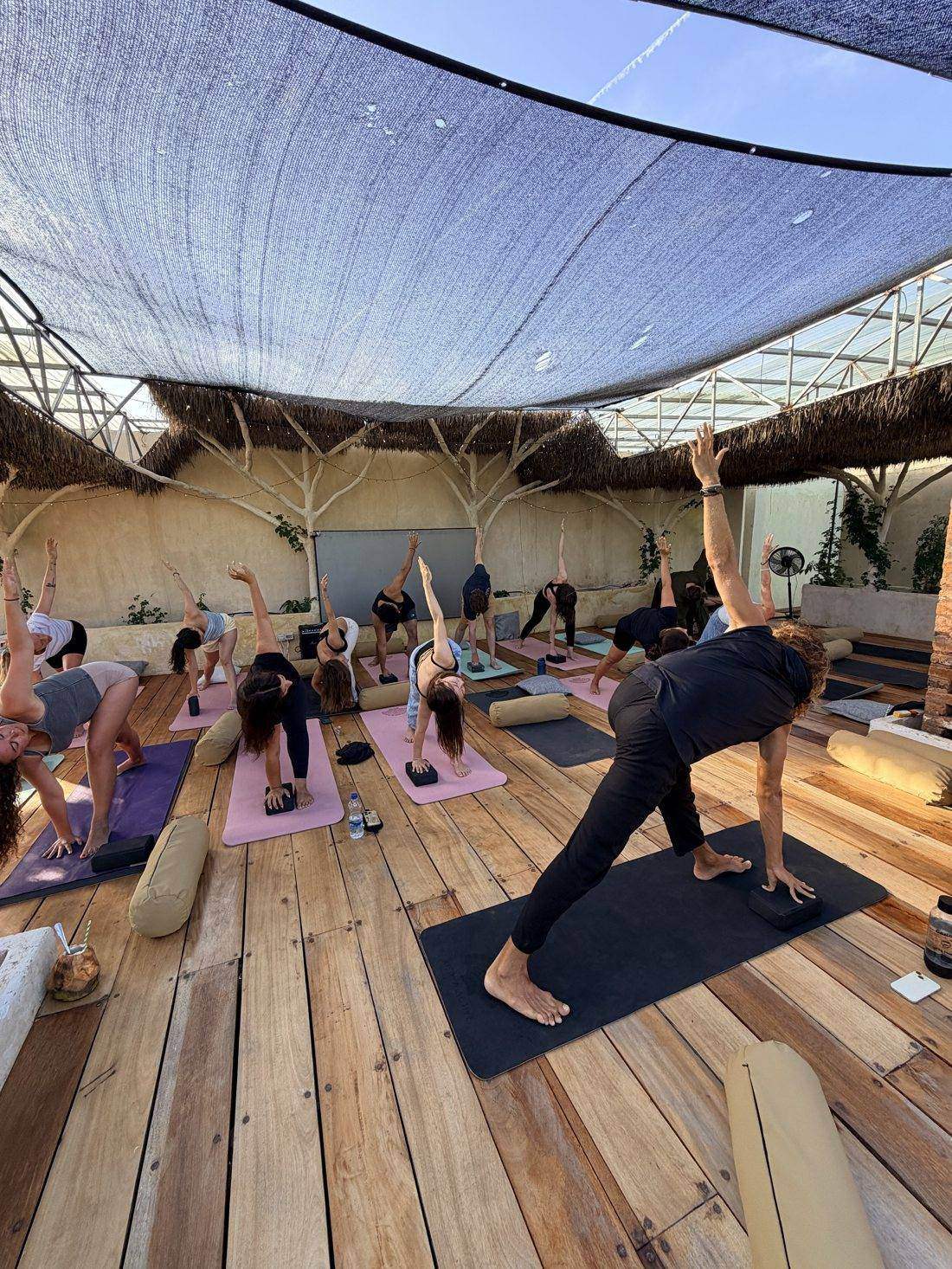 Giulio leading a yoga class